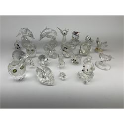 A collection of Swarovski Crystal Miniature Figures, comprising of two dolphins, two oyster shells, two owls, two mice, two pigs, two swans, a squirrel, a bear, a cat, etc, some in original boxes,  some damage but most  is in good condition