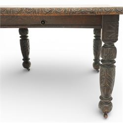 19th century heavily carved oak extending dining table, with winding mechanism and a gadrooned edge, over block and turned supports terminating in castors, extends to 147cm