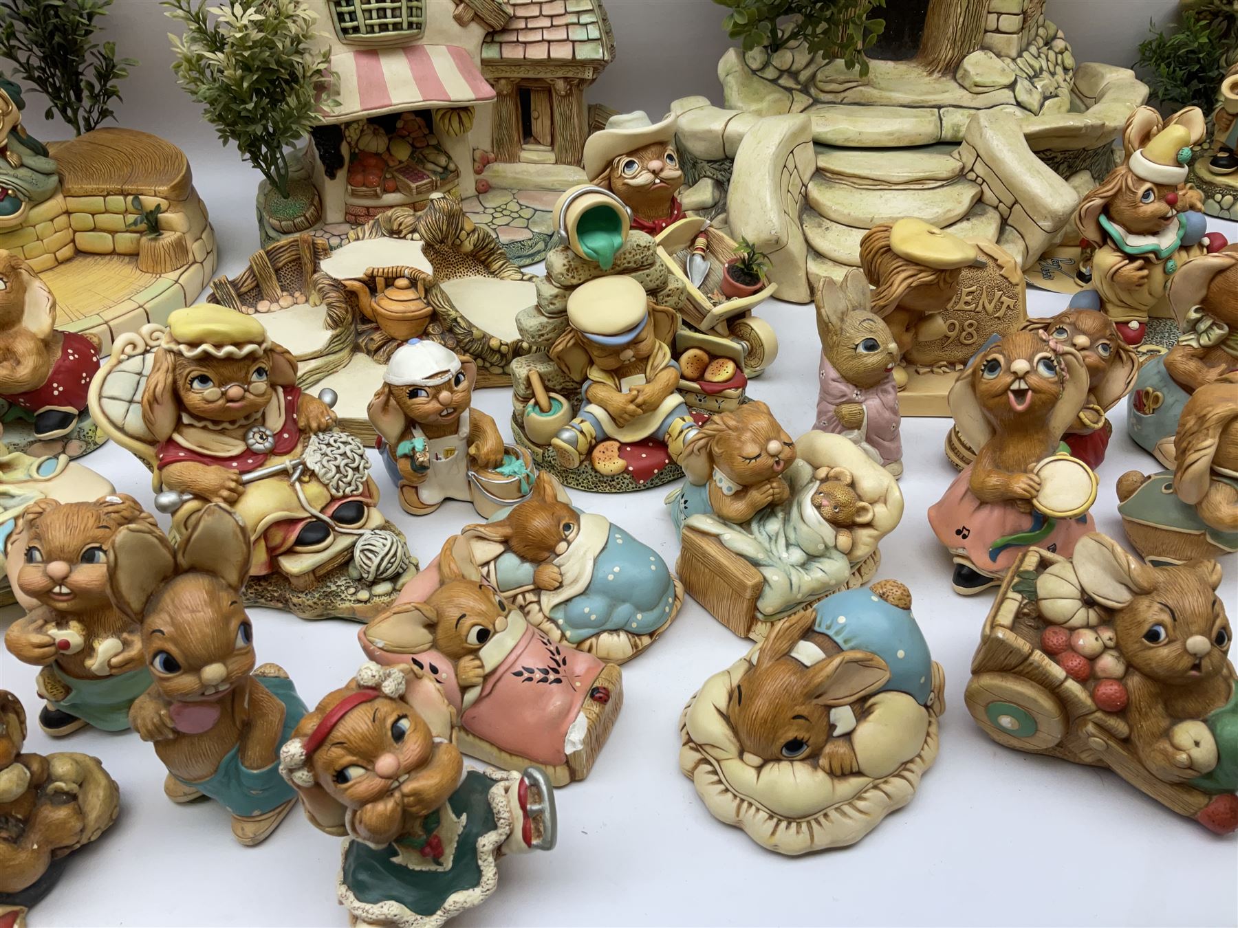 Extensive collection of Pendelfin rabbits and stands, to include Betsy Barge, Fruit Shop, Uncle Soames, Event Piece etc, many with original boxes 