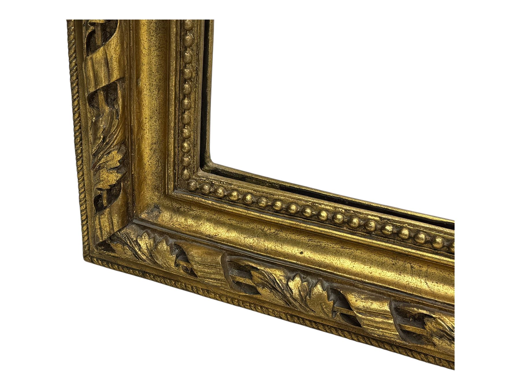 18th century design ornate gilt framed overmantle mirror, bevelled mirror plate within arched frame with pierced pediment featuring foliate and scrollwork designs