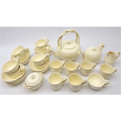  Royal Creamware tea and coffee ware comprising large tea kettle, teapot, sparrow beak cream jug, lidded sugar bowl, nine tea cups, six coffee cups and fifteen saucers, all with twisted handles (34)  