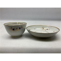 Two 18th century Newhall tea bowls and saucers, the first example decorated with pattern no 195, hand painted painted with floral sprays, the second hand painted with flowers in a gilt boarder, together with a similar tea bowl