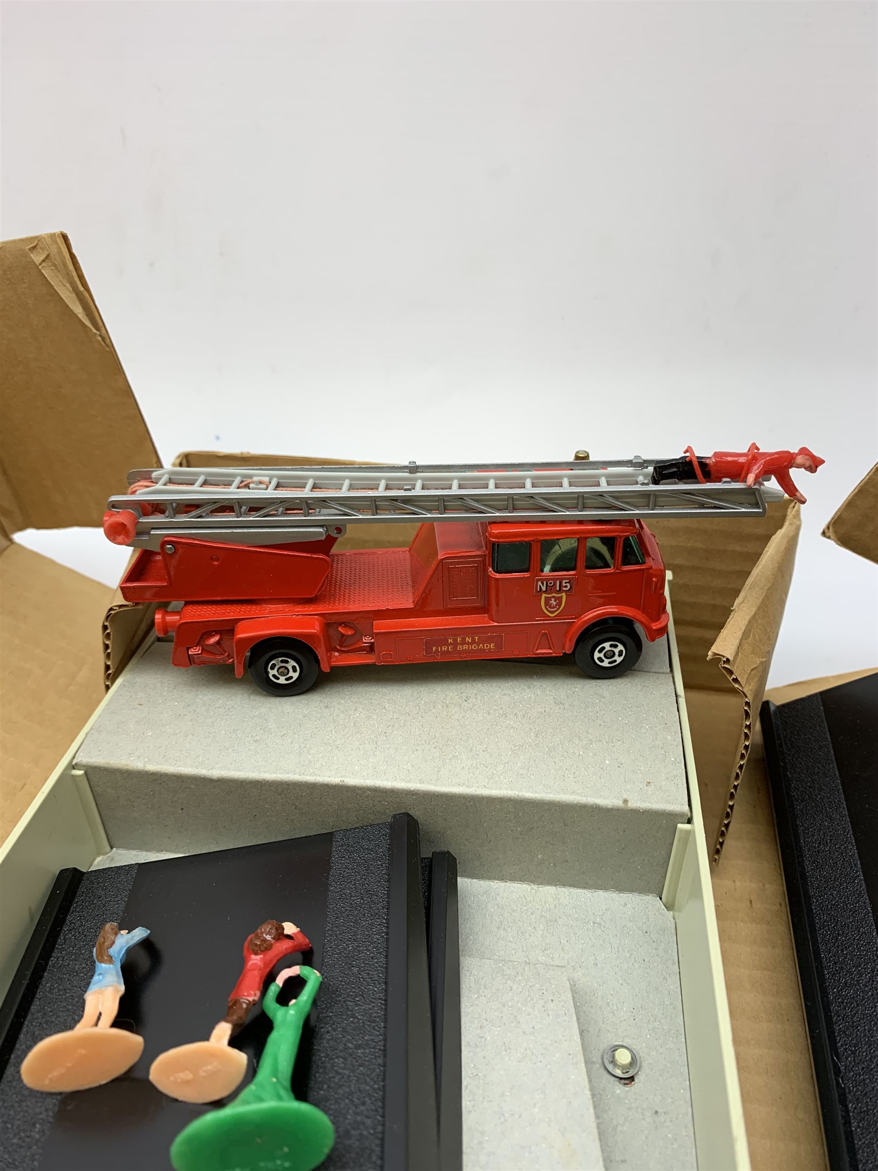Matchbox Big MX Fire/Rescue and Mechanised Fire Engine No.BM-6; and Matchbox Big MX Power Activator; both boxed; together with a Tri-ang/Hornby '00' gauge model railway tunnel No.R576, boxed (3)