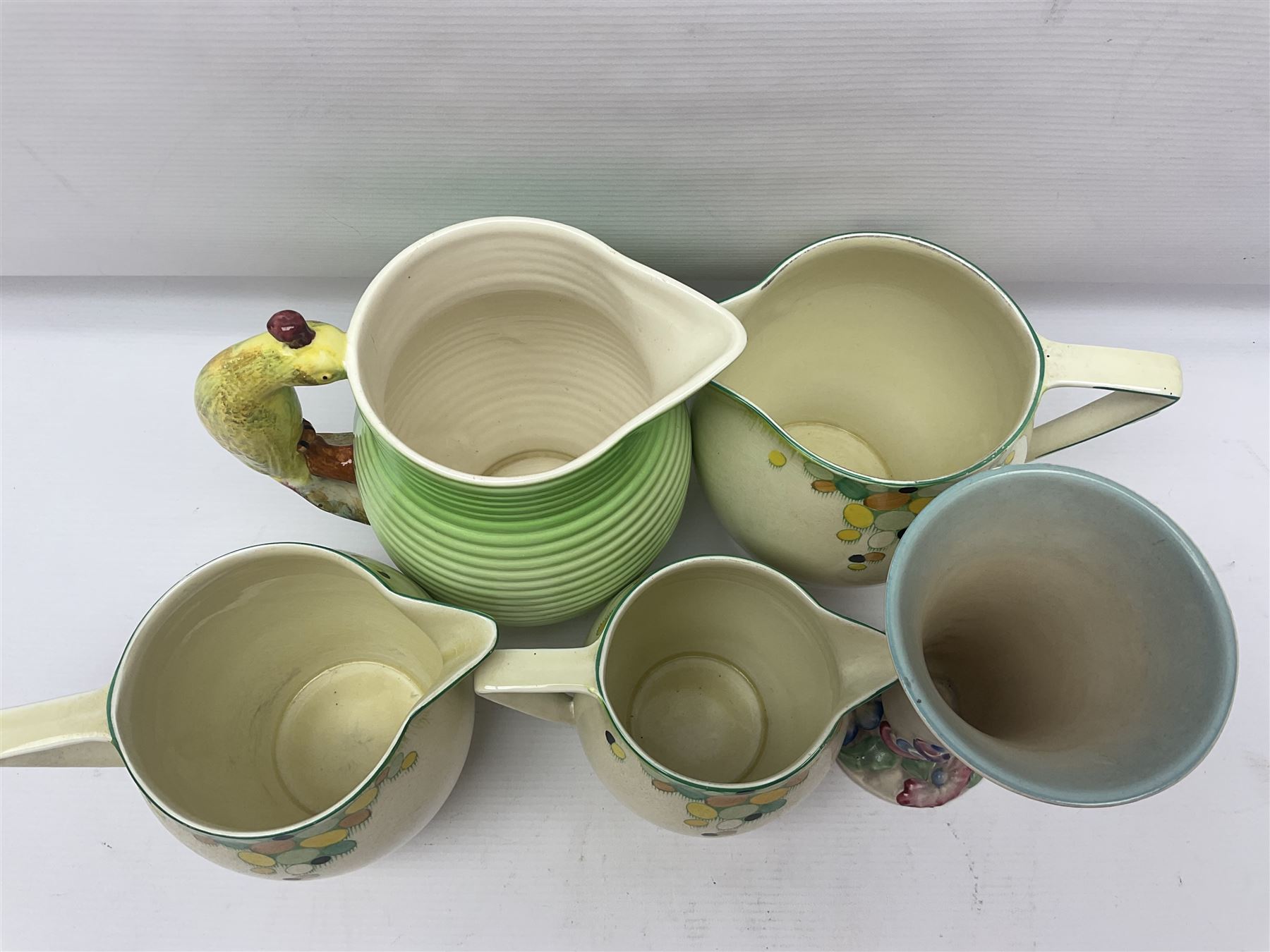 Collection of 1930s ceramics, comprising Shorter & Son jug with bird handle, set of three J.H.W & Sons graduating jugs, Clarice Cliff My Garden pattern vase and Celtic Harvest pattern cake plate and a Burleigh Ware sandwich plate set, bird jug H21cm