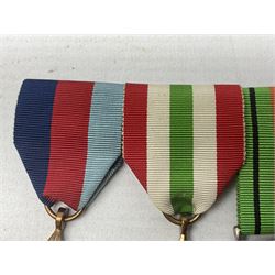 WW2 group of four medals comprising 1939-1945 War Medal, Defence Medal, Italy Star and 1939-1945 Star; with Royal Army Service Corps cap badge and RASC chrome and enamel sweetheart brooch