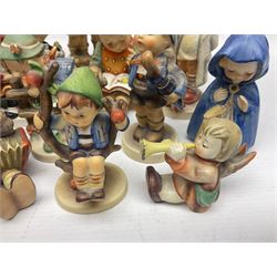 Sixteen Goebel Hummel figures, including Charlot A Young Man's Fancy, Stormy Weather and Bookworm, all with impressed and printed marks beneath