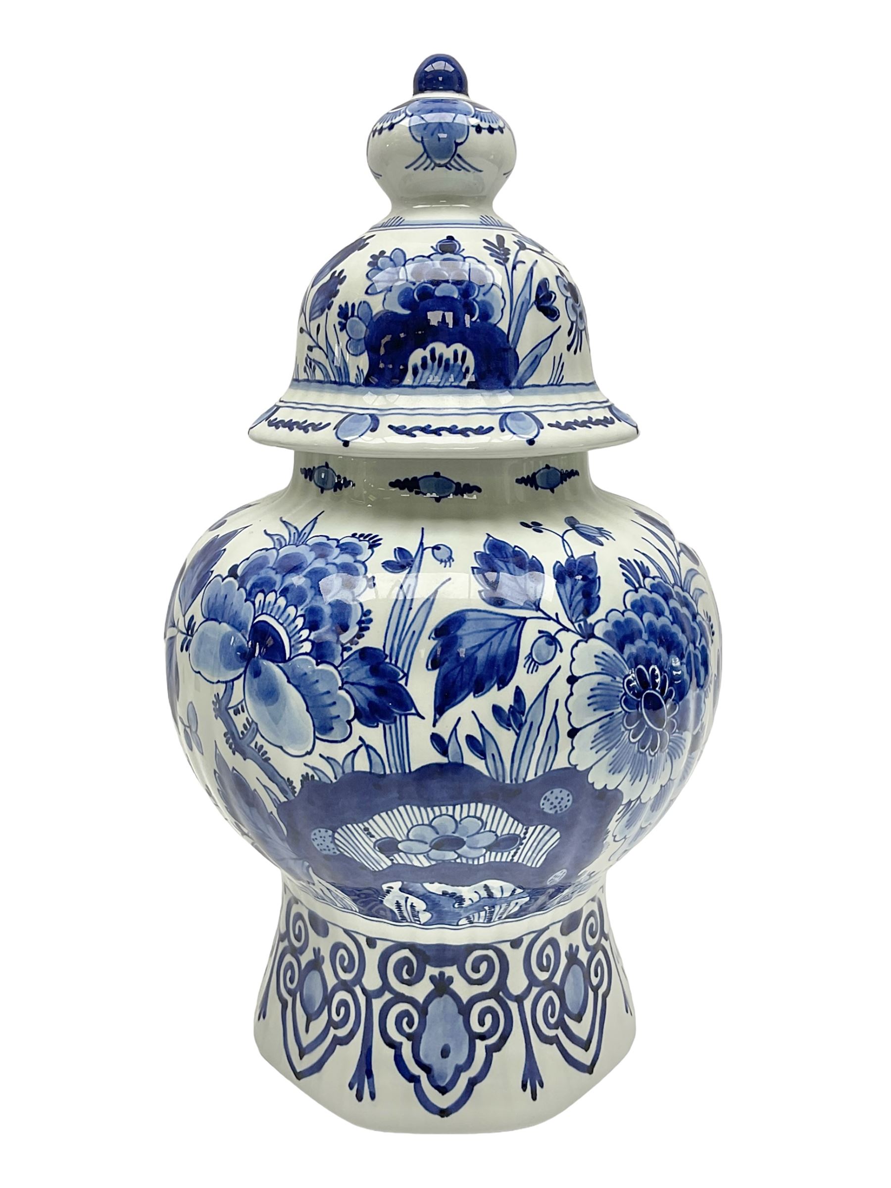 De Porceleyne Fles Delftware blue and white covered jar, of fluted baluster form, with floral and insect decoration, upon an octagonal foot, the octagonal cover with urn shaped finial, H32cm