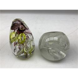 Collection of paperweights to include Baccarat clear glass elephant, L13cm, two boxed Caithness examples including Snow Trail, two boxed Swarovski paperwights and a Langham paperweight of pointed form with bubble inclusions, etc (8)