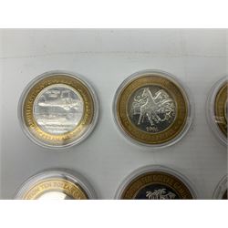 Eight Las Vegas limited edition ten dollar casino silver strike gaming tokens, consisting of a fine silver centre with brass outer ring (8)