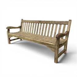 Teak garden bench with slatted back and seat raised on square supports