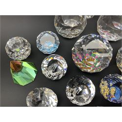 Swarovski Crystal paperweights, to include a globe with dove to the top, pyramid shapes etc, together with a large collection of boxes and stands  