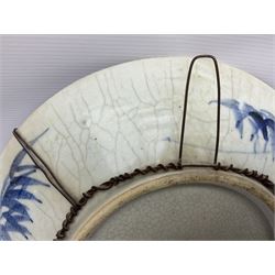 20th century Chinese blue and white crackle glaze charger, decorated with peonies, prunus blossom, and rockwork, within simulated bronze border, with character mark verso, D34cm