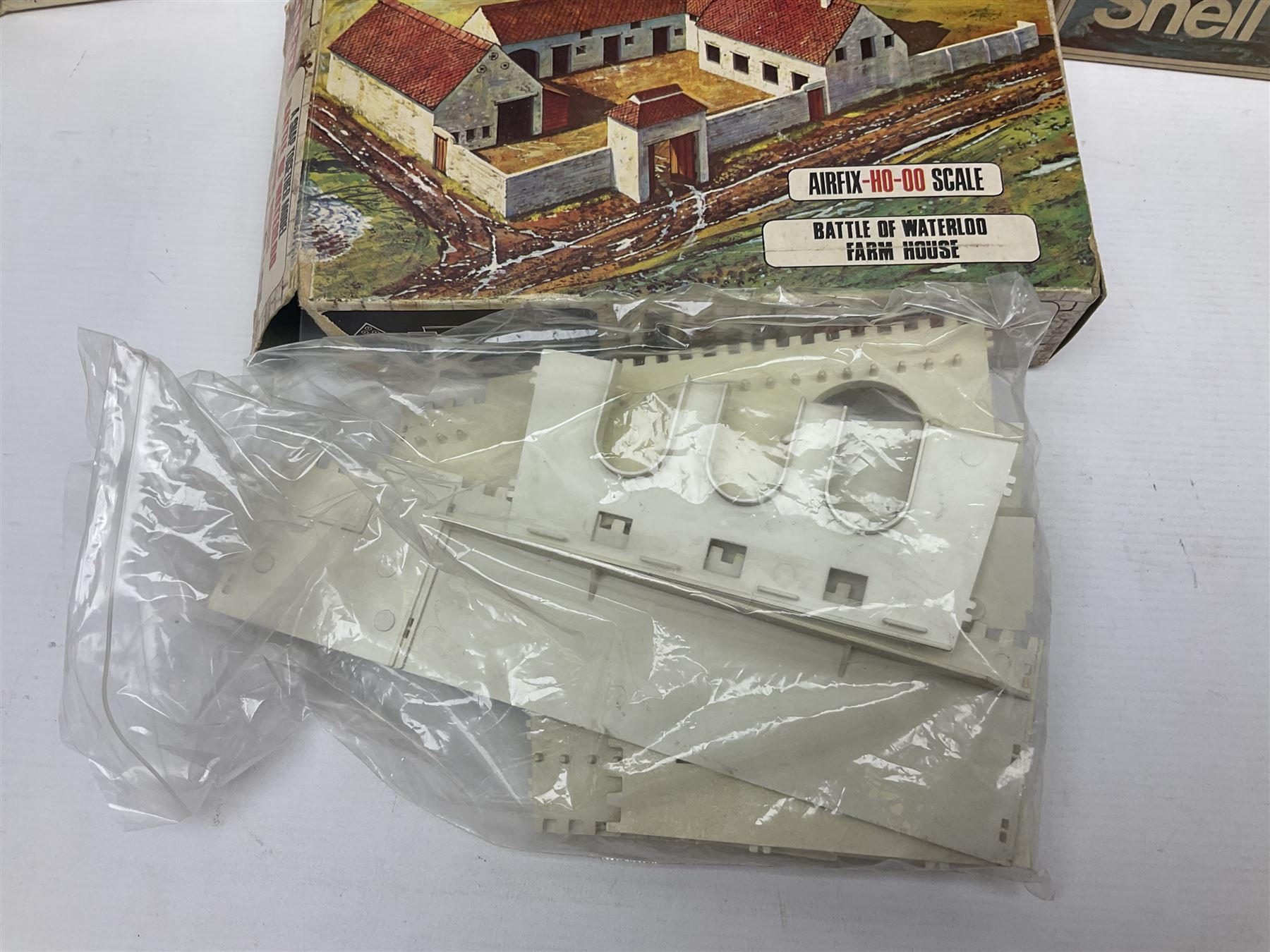 Three unmade construction kits - Airfix 1:24 scale Supermarine Spitfire Mk.1A; predominantly in unopened factory packaging with instructions and decal sheet; Frog Shell Welder with instructions; and Airfix Battle of Waterloo Farmhouse (instructions on box base); all boxed (3)