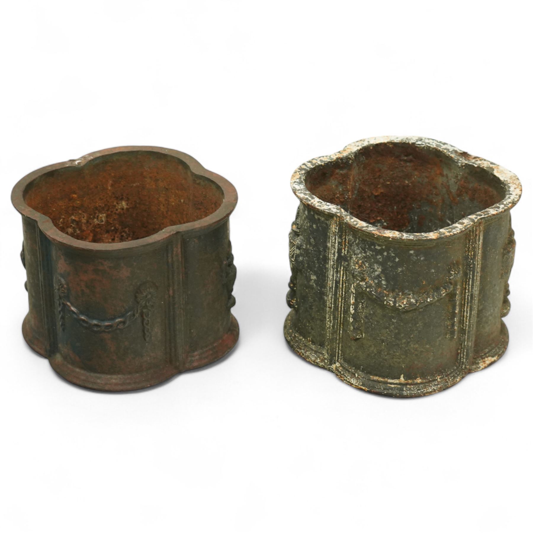 Matched pair of 20th-century cast iron neoclassical style planters, scalloped form with ornamental swag motifs in relief, one planter, probably later, 26cm wide x 22cm high, 29cm wide x 24cm high 