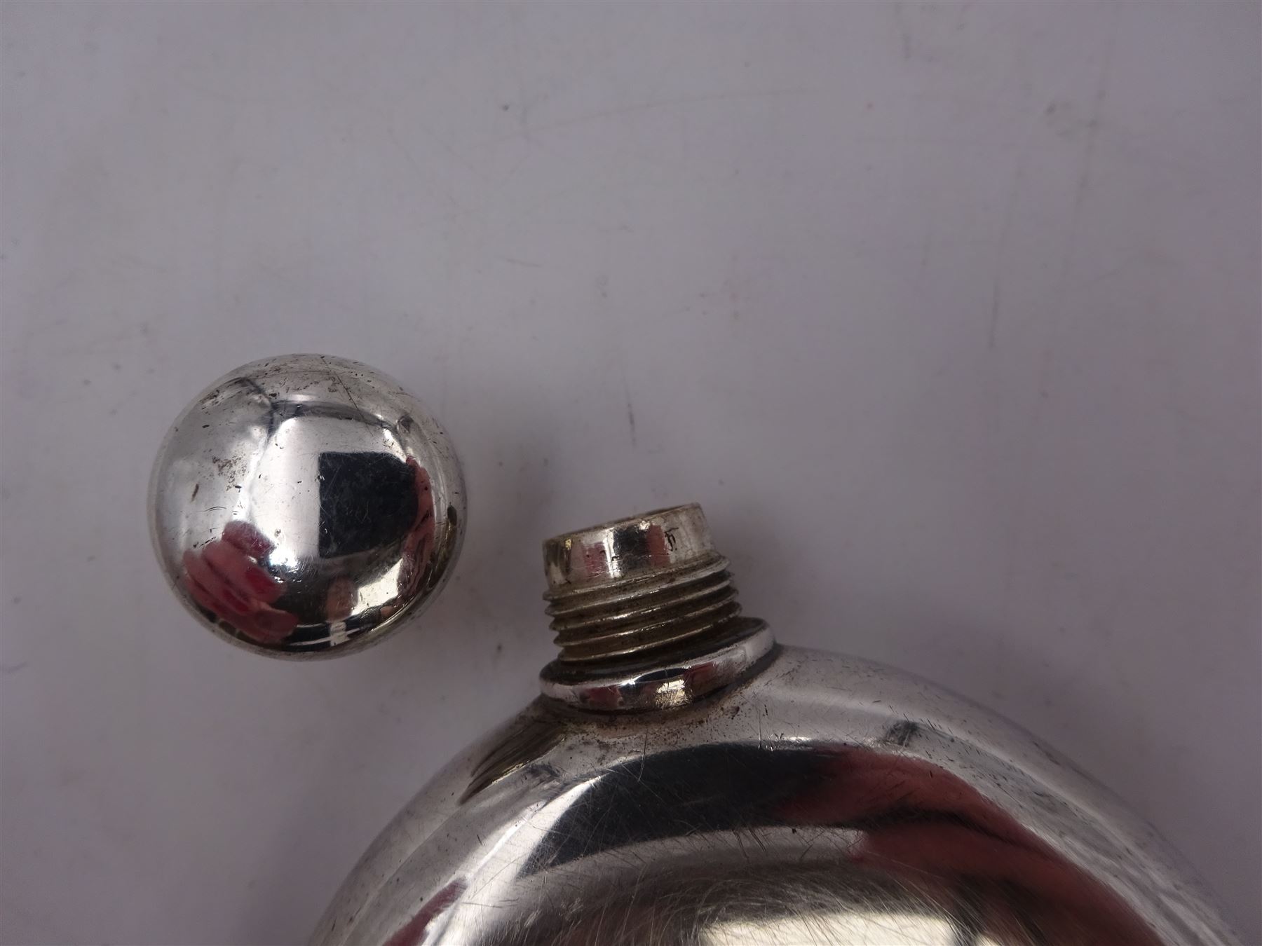 Tiffany & Co silver hip flask, of oval form with screw cap, stamped Tiffany & Co  26503327 Sterling Silver beneath, H11.5cm