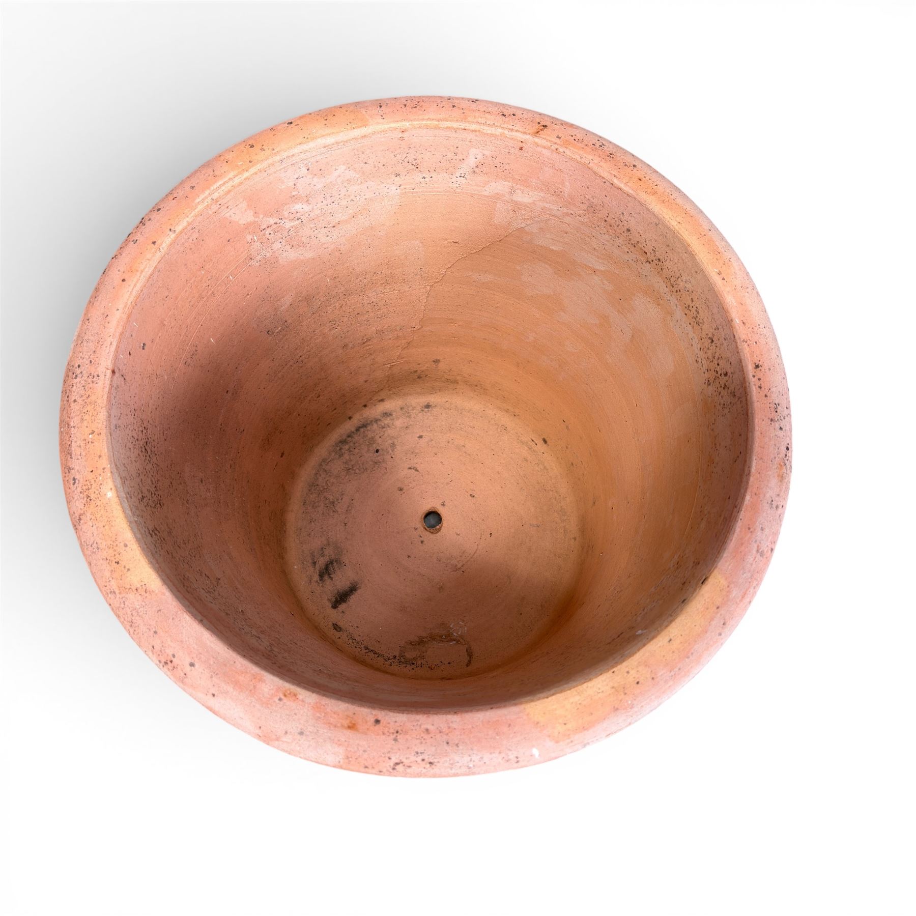 Three terracotta planters with lattice relief and rolled rim