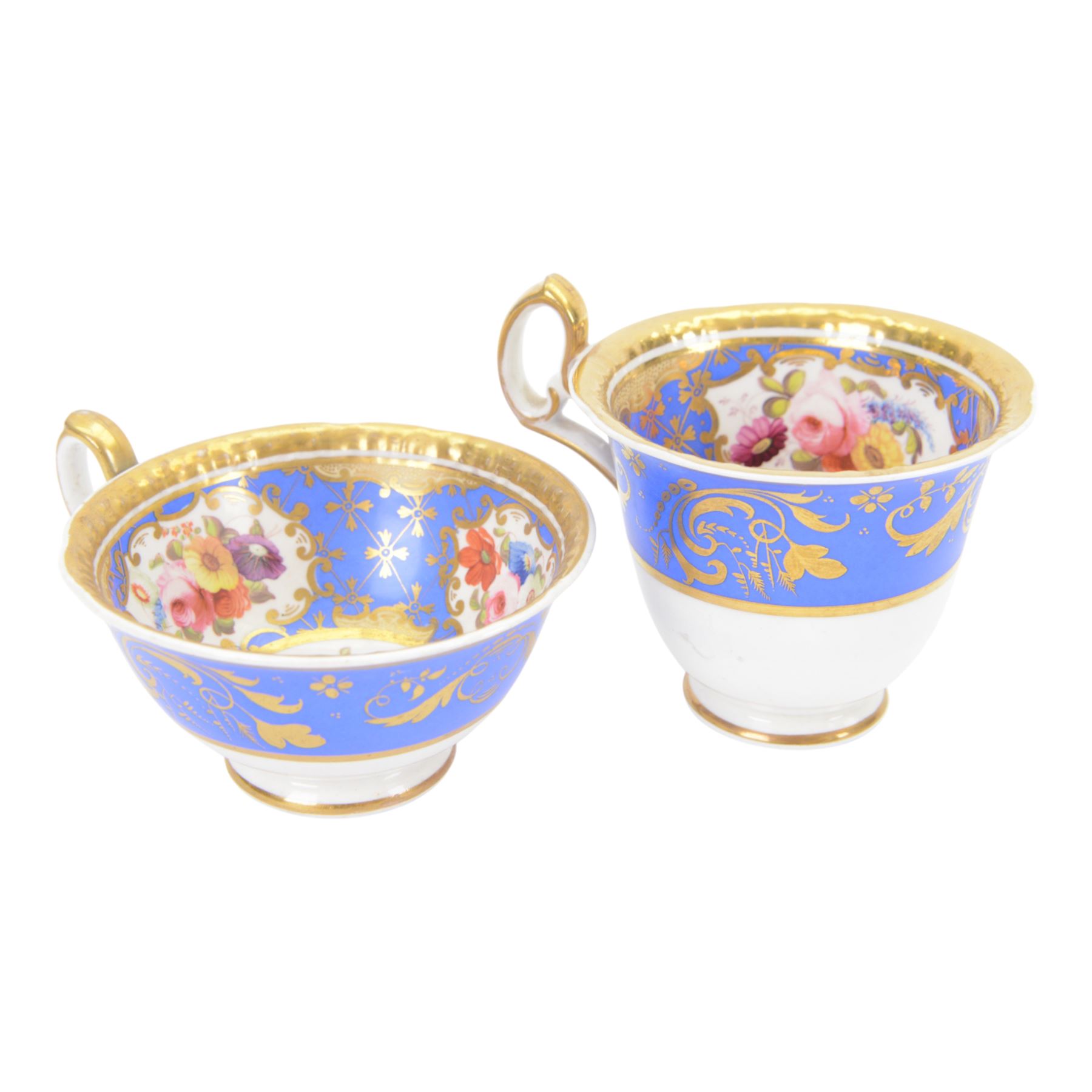 H&R Daniel trio, coffee cup, teacup and a saucer, circa 1825, Gadroon shape with D handle, painted with reserves of fine foliate sprays against a blue ground with gilt trellis detail, coffee cup including handle H8.5cm, saucer D14cm