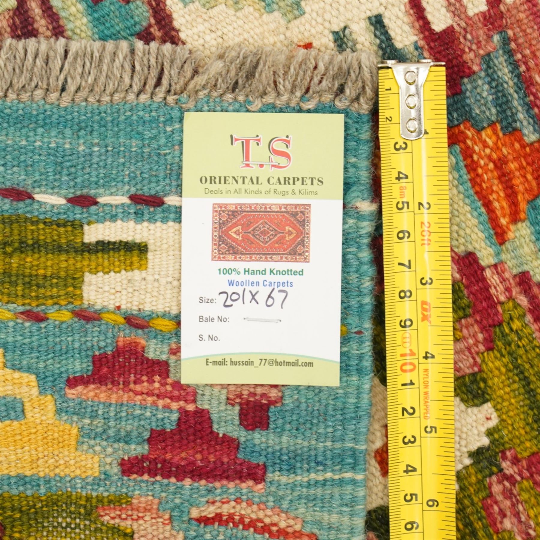 Afghan Maimana flatweave kilim runner, central field features large bold nested diamond motifs and stylized geometric lozenge patterns on olive purple, blue, and green tone ground, border stripe in mustard ground, and fringe