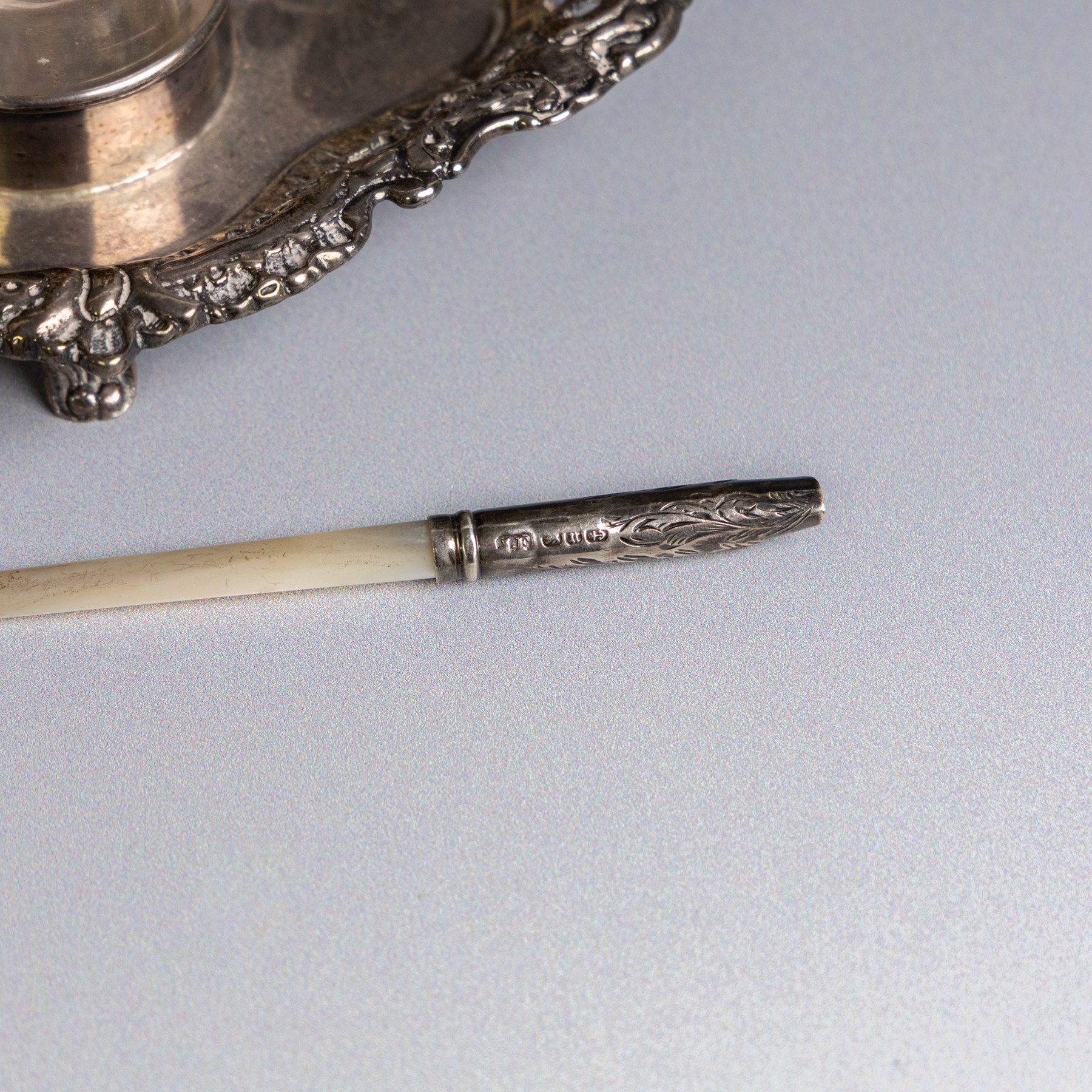 Victorian silver inkwell stand, with silver topped inkwell, hallmarked Lawrence Emanuel, Birmingham 1893, together with a mother of pearl dip pen with silver collar and two silver topped jars, one with guilloche enamel decoration, all hallmarked