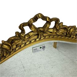 Wall mirror in shaped gilt frame with ribbon pediment