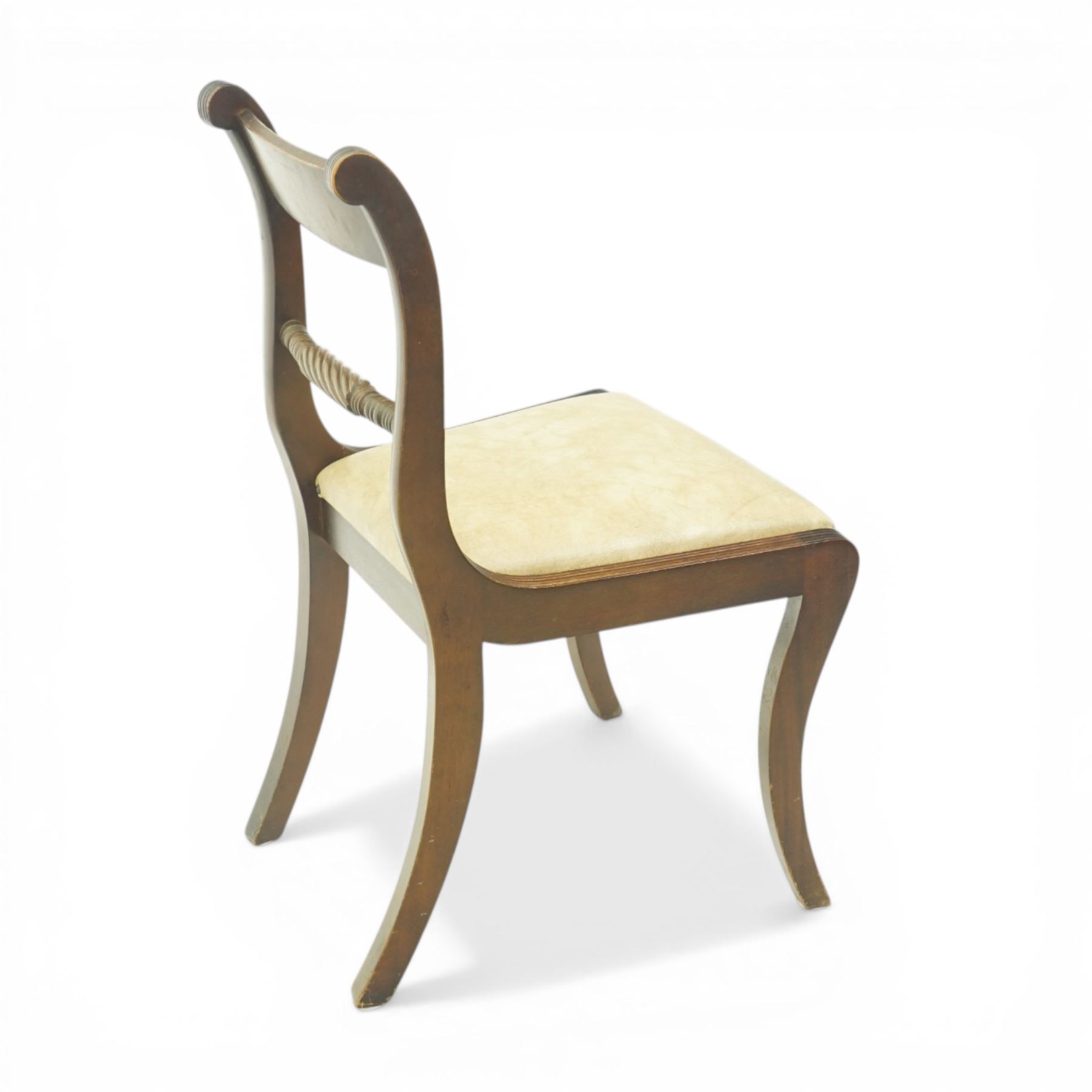 Late 20th century Regency style mahogany dining chairs, set of four, bar backs with figured veneered top rails and turned spindle stretchers, drop-in seats upholstered in beige leather, on moulded sabre supports