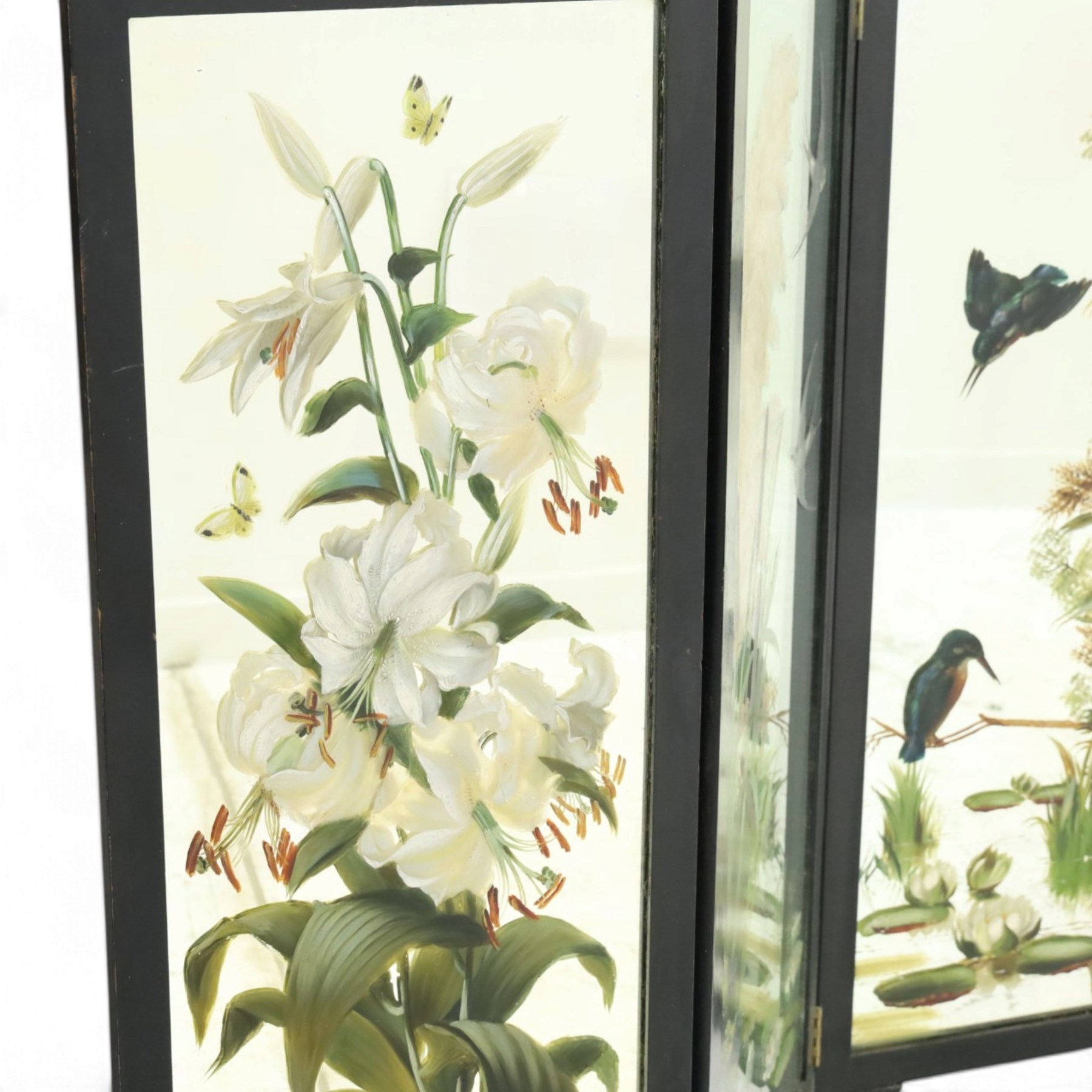 Late Victorian Aesthetic Movement ebonised and painted three-panel folding mirror screen, spindle gallery cresting rail over three rectangular mirror plates painted with floral pond scenes with lily-pads, swallows and kingfishers, each panel W37cm H110cm)
