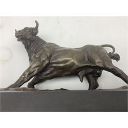 Bronze figure, modelled as a prancing bull, upon a naturalistic base signed Mils and with foundry mark, raised upon a rectangular marble base, overall H14cm