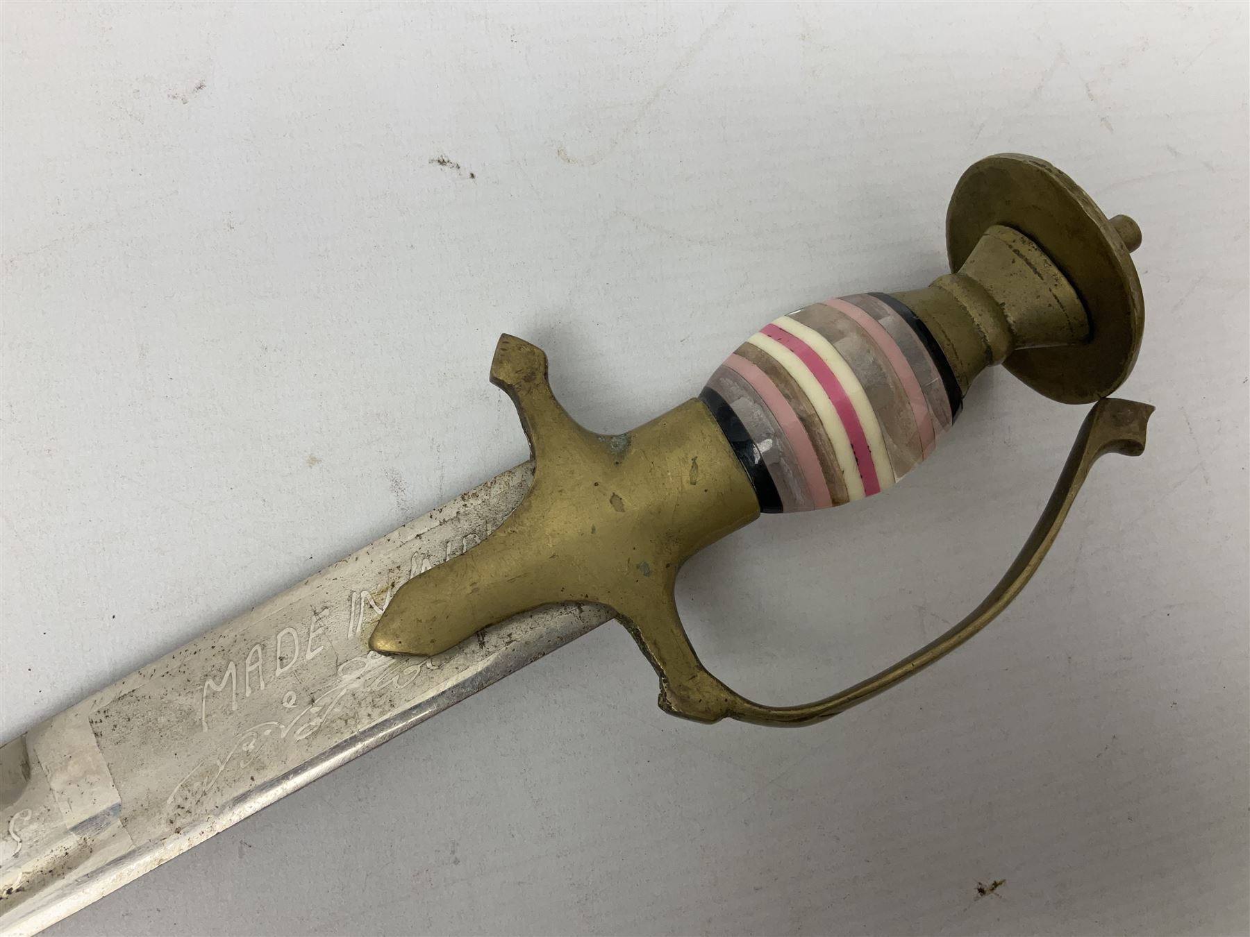 Early 20th century Indian ebonised sword stick, the 59.5cm blade with punched decoration and horn grip L94cm overall; and a reproduction Indian tulwar with scabbard (2)