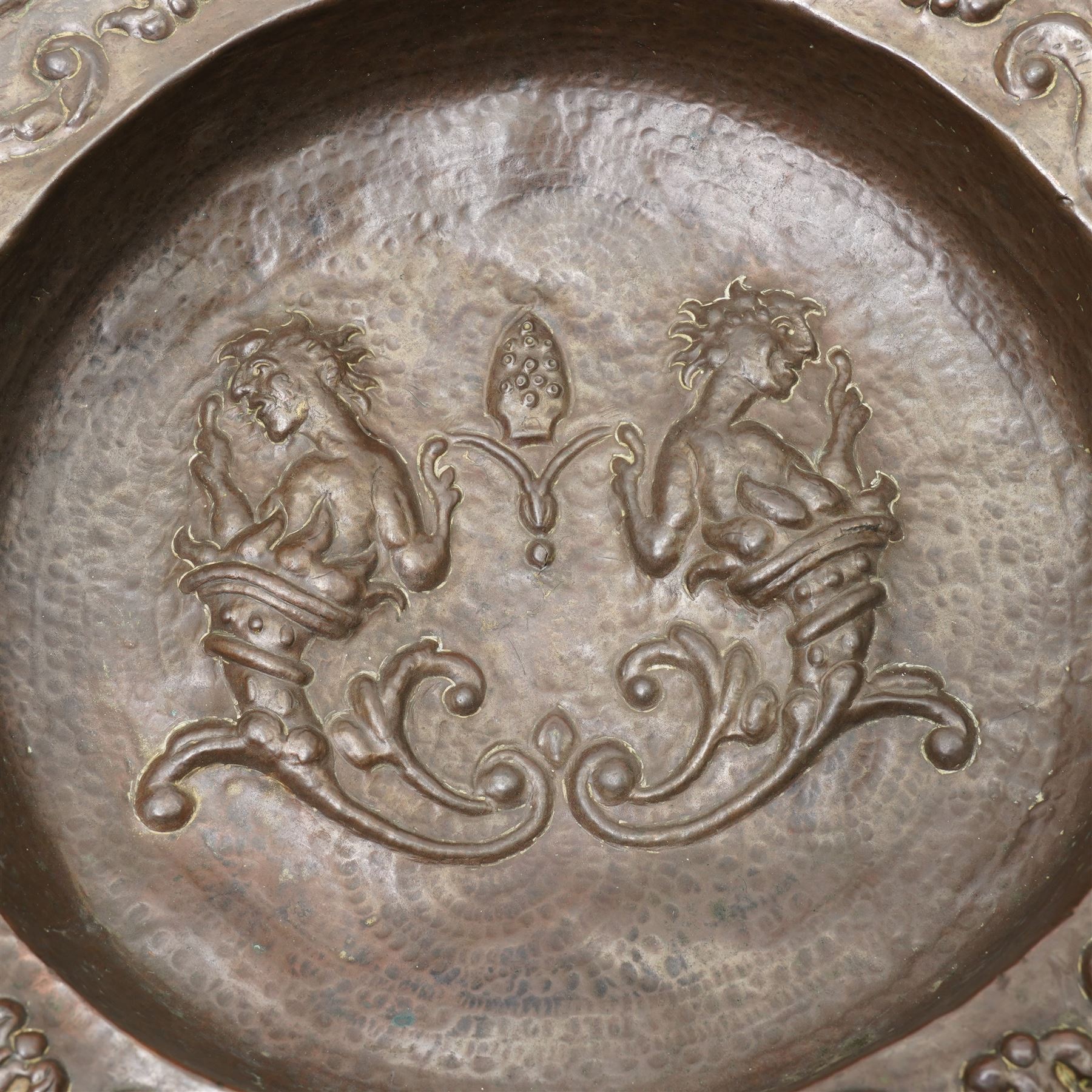 18th century Venetian copper two handled brazier, the base embossed with figures emerging from a cornucopia and a bishop's mitre, the border with embossed scrolls etc D50cm