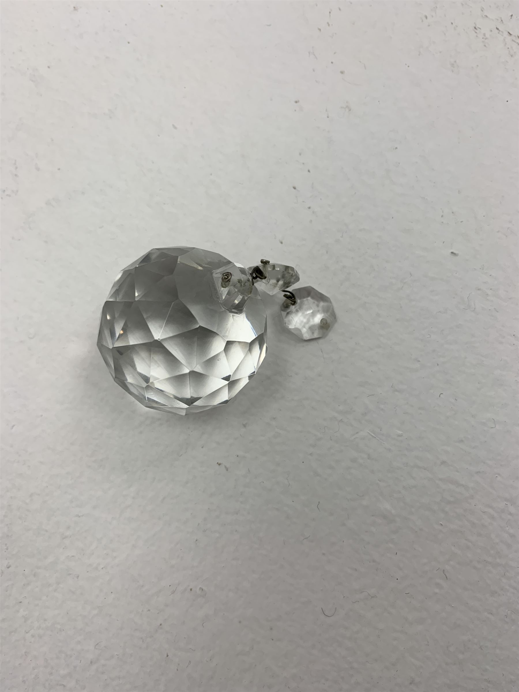 A glass chandelier, with five curved branches with drip pans and droppers, approximately H69cm. 