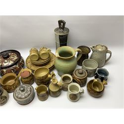 A group of assorted Studio Pottery, to include part dinnerware set comprising four dinner plates, four side plates, two jugs, preserve pot, gravy pan, and four soups bowls, together with a large green glazed jug, small butter jar, etc., of various form and decoration, various makers marks. 