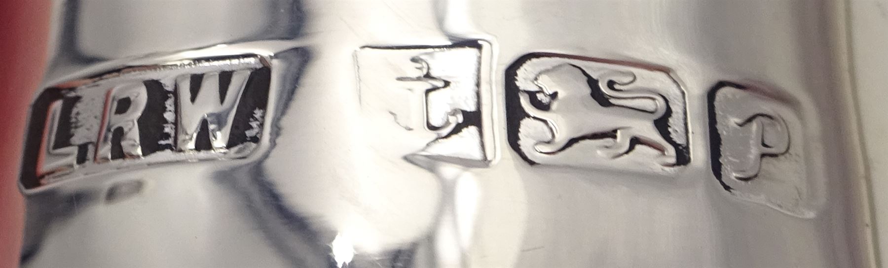 Modern silver two piece cruet set, comprising salt shaker and pepper shaker, both of waisted form with engraved rope twist borders, the removable pierced covers each with engraved lattice decoration, upon a circular spreading foot, hallmarked Laurence R Watson & Co, Birmingham 1989, H14.5cm, contained within velvet lined fitted case