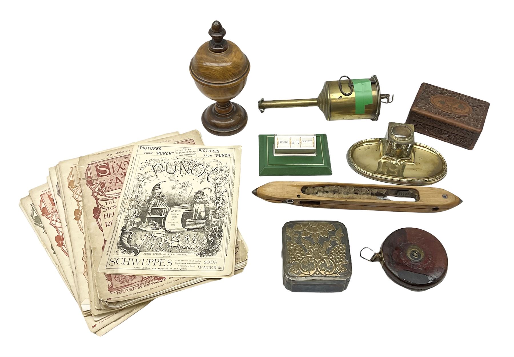 Olive wood lidded urn/vase, brass inkwell, Art Deco style perpetual desk calendar, leather bound Chesterman tape measure, brass roasting spit, Punch Magazines etc