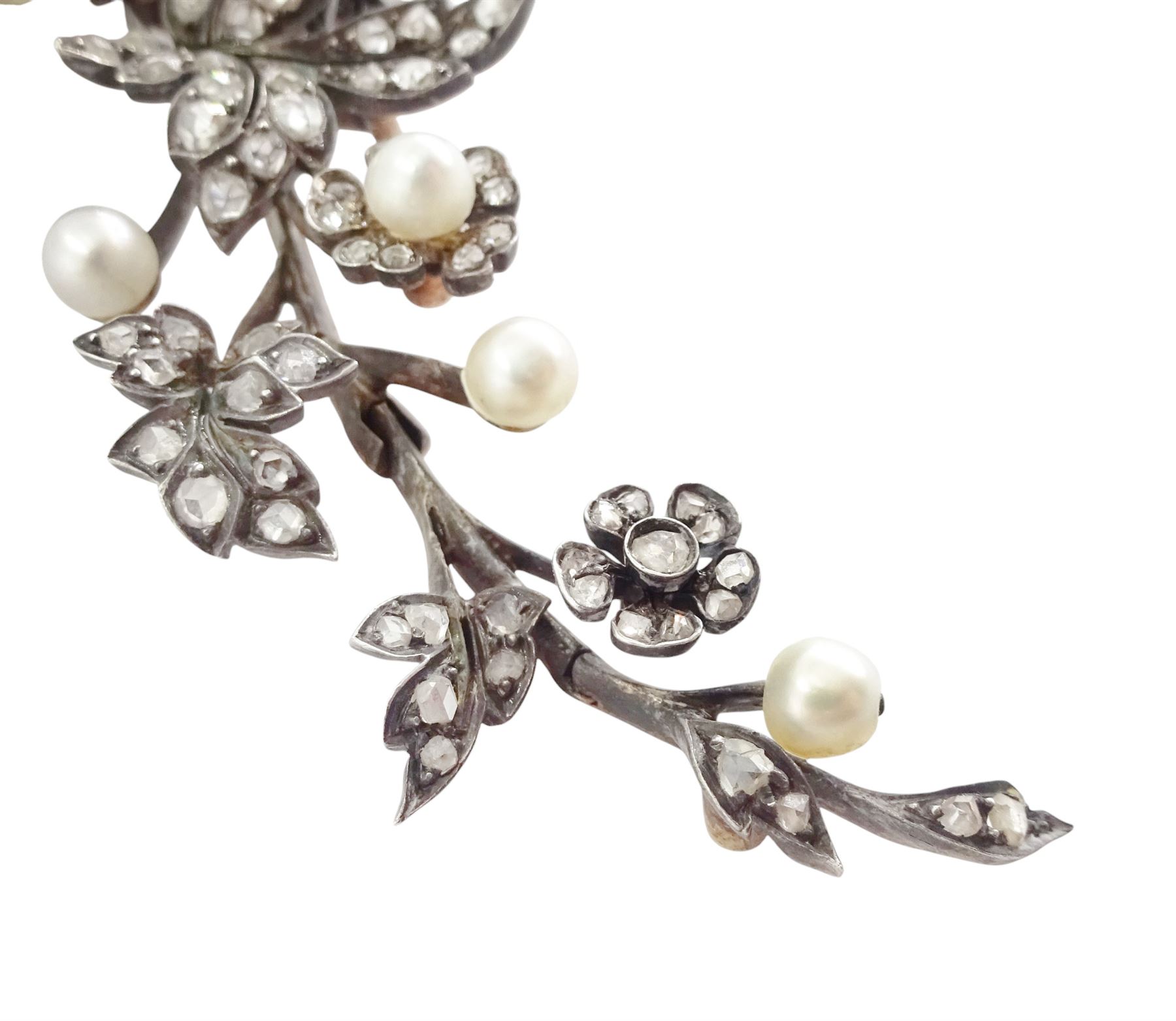 19th century gold and silver diamond and pearl en tremblant detachable brooch, the flower tremblant with a principal old cut diamond of approx 1.90 carat, the petals and stamen set with old cut and rose cut diamonds, total diamond weight approx 9.10 carat, to a foliate spray set set with further rose cut diamond and white / pink / cream pearls and ribbon tie