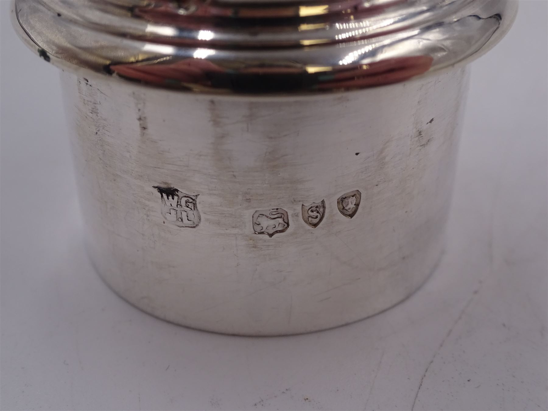 Victorian silver sugar caster, of bellied form, with repousse scroll and foliate decoration, the removable pierced cover with flambeau finial, upon a conforming circular spreading foot, hallmarked Goldsmiths & Silversmiths Co, London 1893, H18.5cm