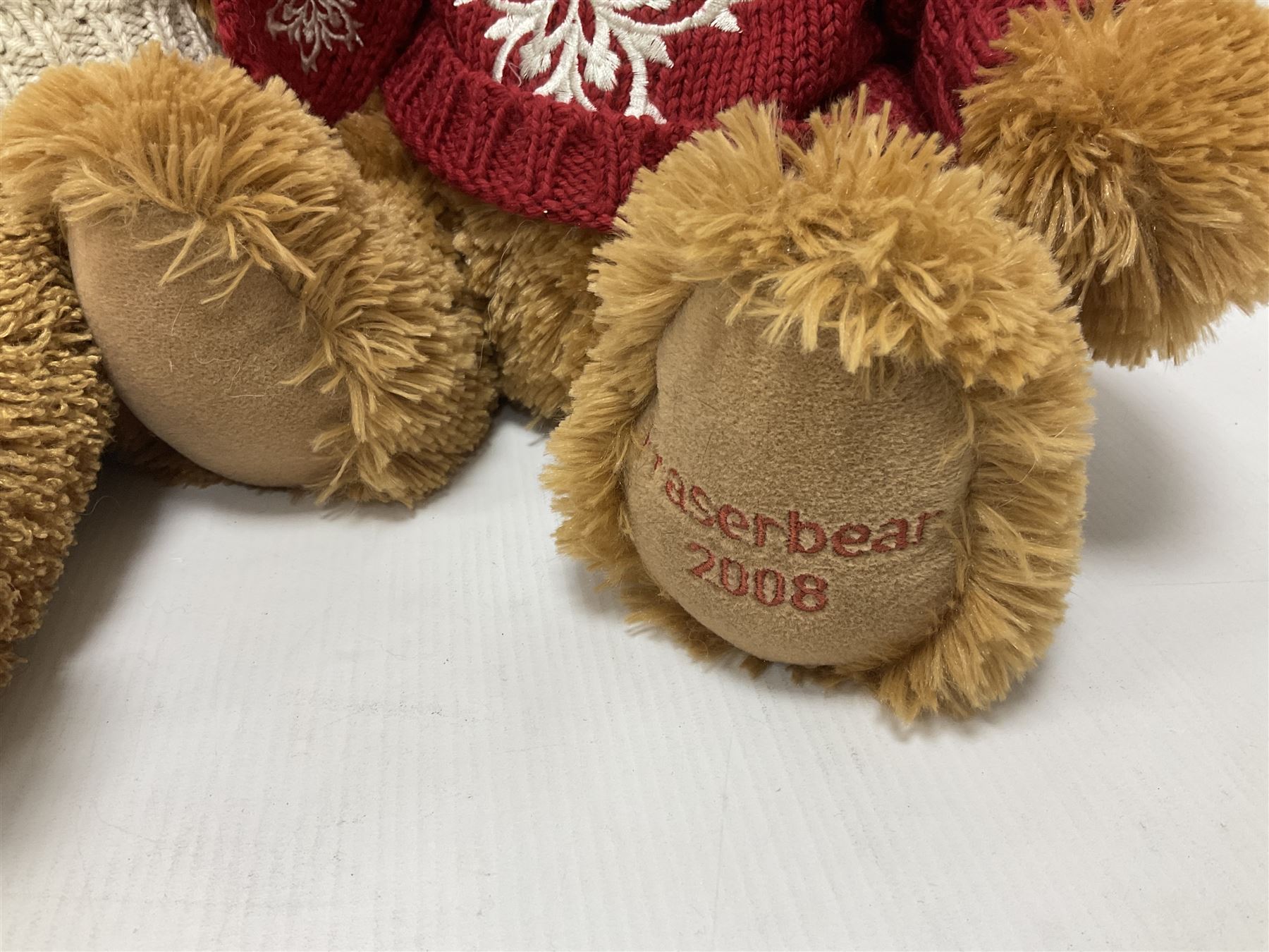 Eight annual Fraser Bears, by House of Fraser, dating between 2004 and 2011, tallest H46cm