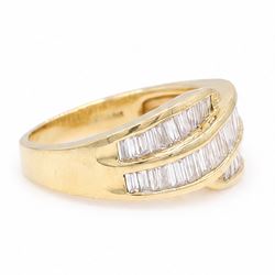 18ct gold diamond crossover ring, channel set with three rows of baguette cut diamonds, 1994
