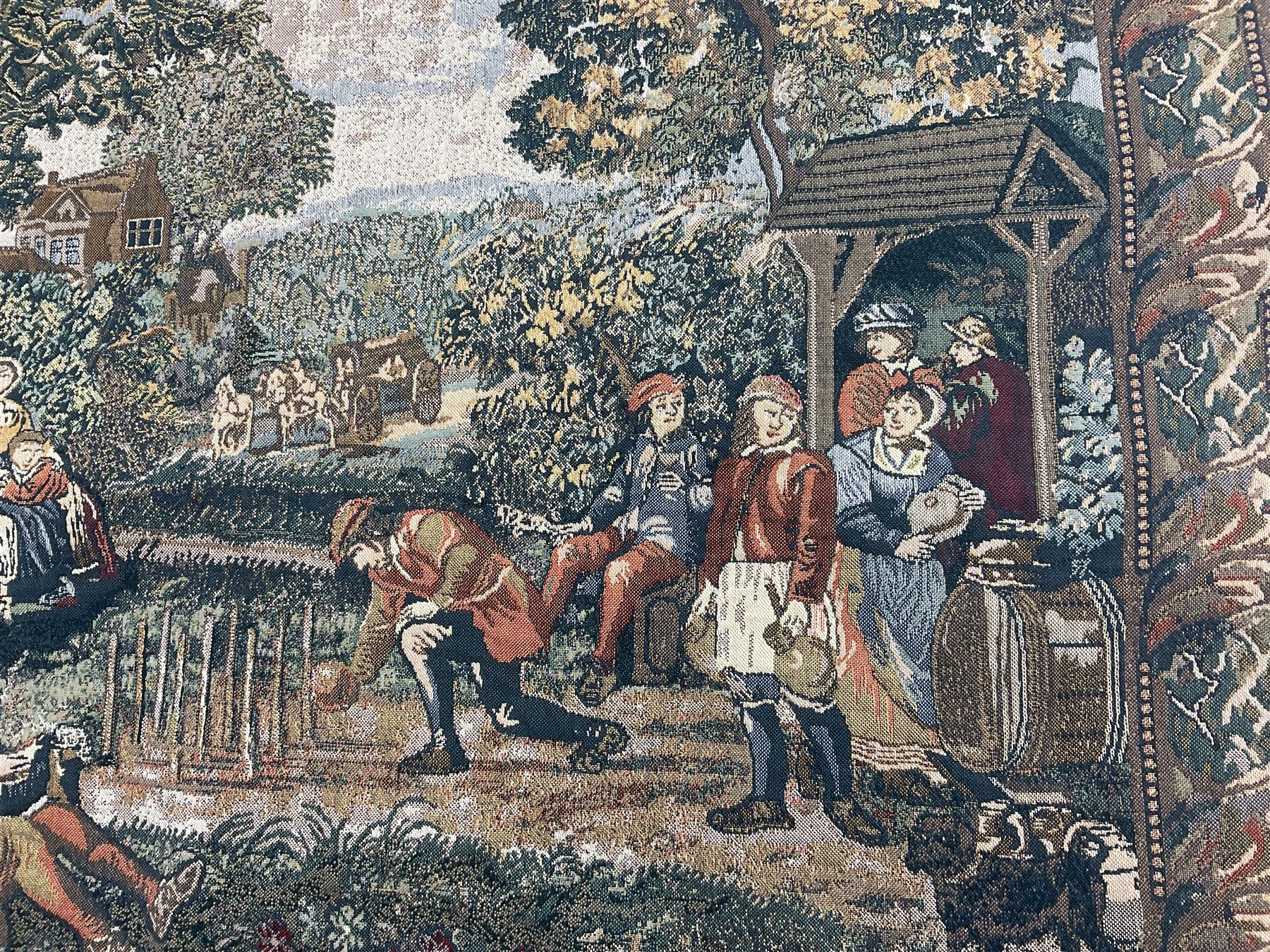 Three tapestries comprising 20th century wool tapestry panel of a medieval nobleman upon a horse with a castle in the distance, together with a smaller tapestry depicting The English Coat of Arms, both hung on rails, and further depicting village scene, largest approx 132cm x 95cm