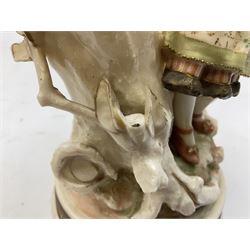 Late 19th century continental spill vase as a young girl standing beside an open tree trunk H21cm; and three German bisque figures (4)