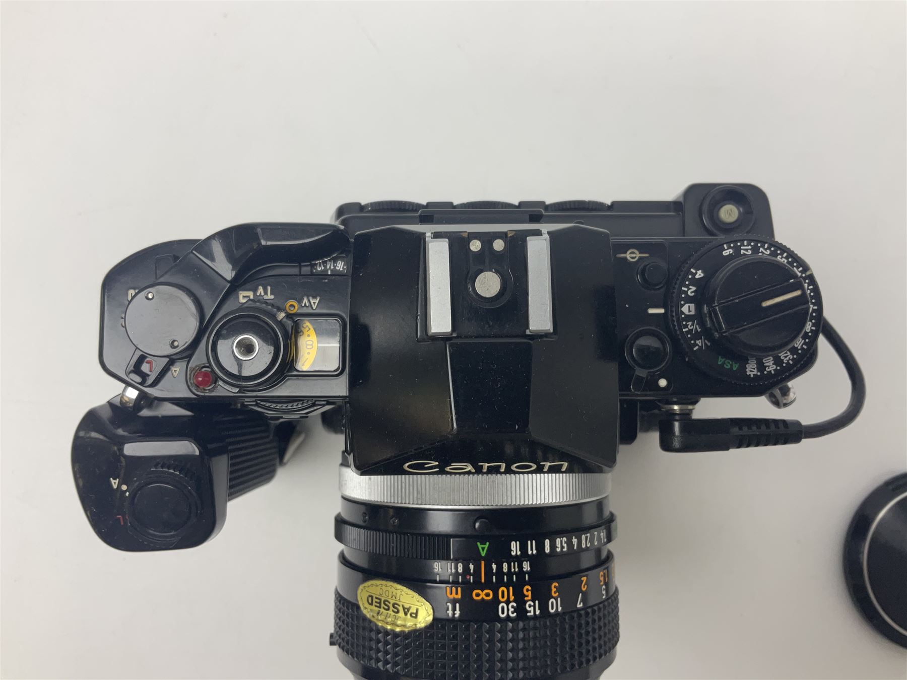 Canon A-1 camera body, serial no. 341014, with 'Canon FD 50mm 1:1.4 S.S.C.' lens, serial no. 12077119 and motor drive MA