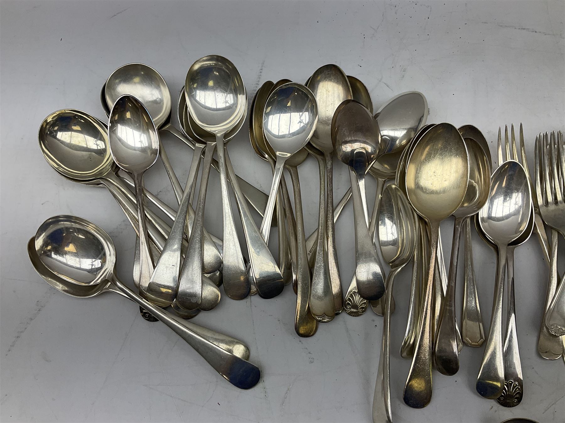 Four butter knives with hallmarked silver handles together with a Quantity of silver-plated cutlery stamped Ashberry and other stainless steel cutlery