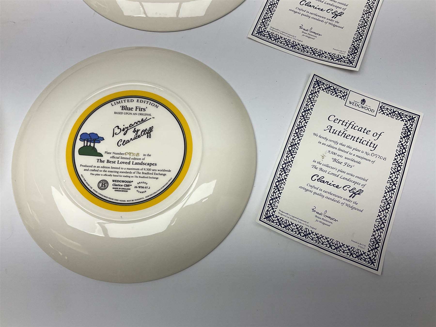 Four Clarice Cliff Wedgwood limited edition plates, comprising Orange Erin, Blue Firs, Solitude and May Avenue, all with certificate and box, D26cm