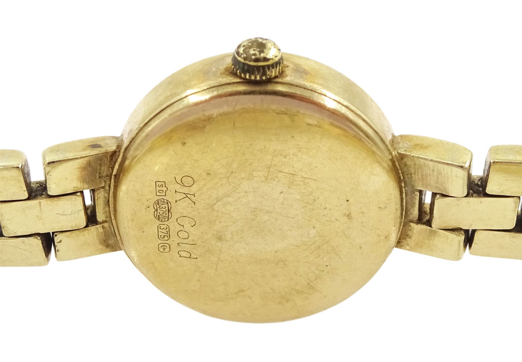 Rotary ladies 9ct gold quartz wristwatch, mother of pearl dial, on integral 9ct gold bracelet, stamped 375