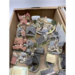 A collection of boxed David Winter cottages, of various size and form, to include Wreckers Cottage, Scottish Collection Macbeth's Castle, Special for Christmas 1988 Christmas in Scotland and Hogmanay, Special for Christmas 1990 Mister Fezziwig's Emporium, The Scrooge Family Home, Special for Christmas 1989 A Christmas Carol, The Midlands Collection Miners Row, Will-o-the wisp, etc., together with a plaque titled On the Riverbank, a number of examples with accompanying certificates. (30).