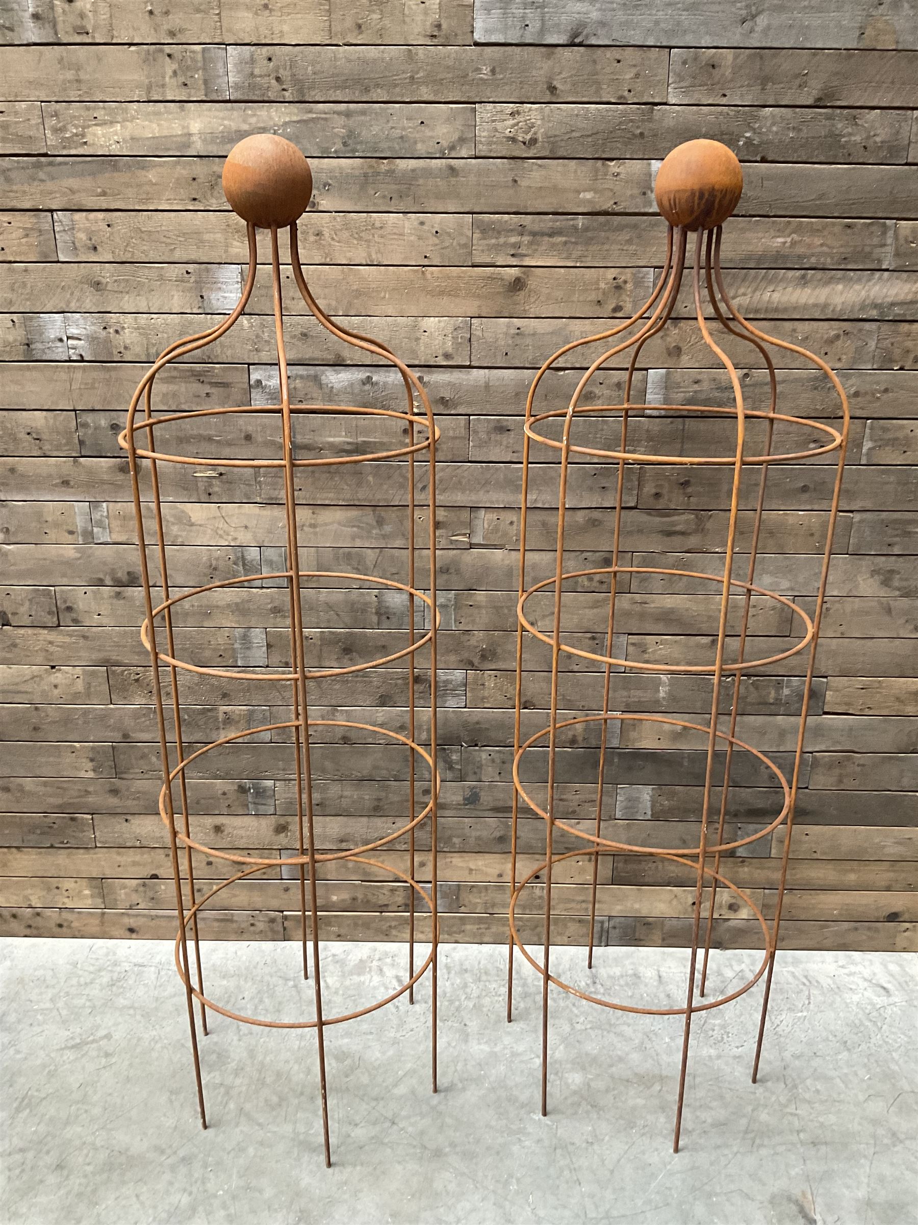 Pair of Country House wrought iron garden obelisks with ball finial, raise in four tiers