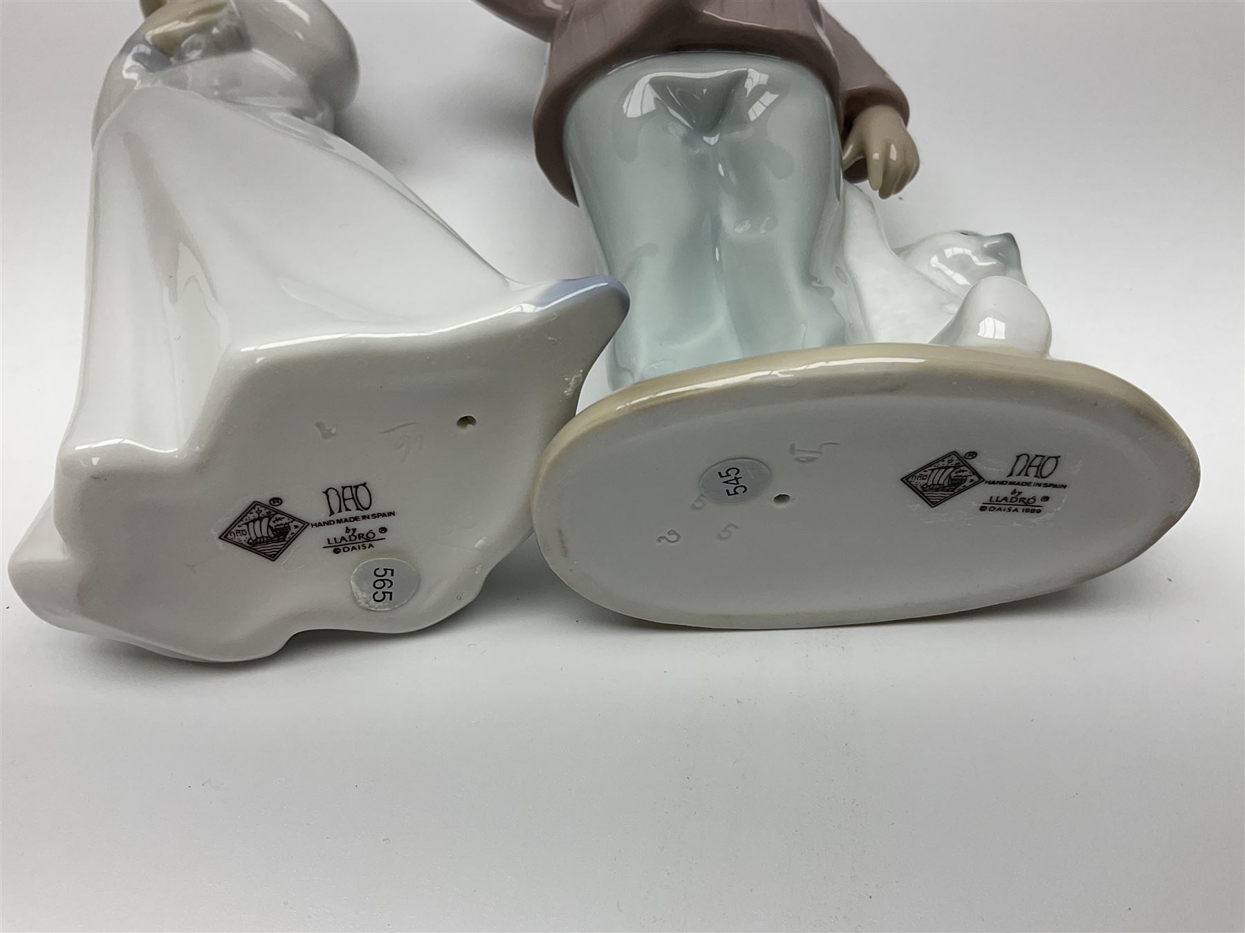 Eleven Nao figures to include Cowboy, Girl with Puppy, Clown, Girl in hat etc 