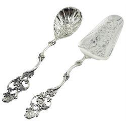 Early 20th century Norwegian silver cake cake slice and matching serving spoon, each with shaped stem and pierced and foliate modelled terminal, and engraved foliate decoration to bowl and blade, with fineness stamp 830S, NM 'Norskt Monster' mark, and makers mark for Thorvald Marthinsen Sølvvarefabrik, Tonsberg, approximate weight 2.90 ozt (90.5 grams)