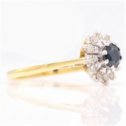 18ct gold sapphire and diamond cluster ring, single round cut sapphire surrounded by twelve single cut diamonds, Birmingham 1985