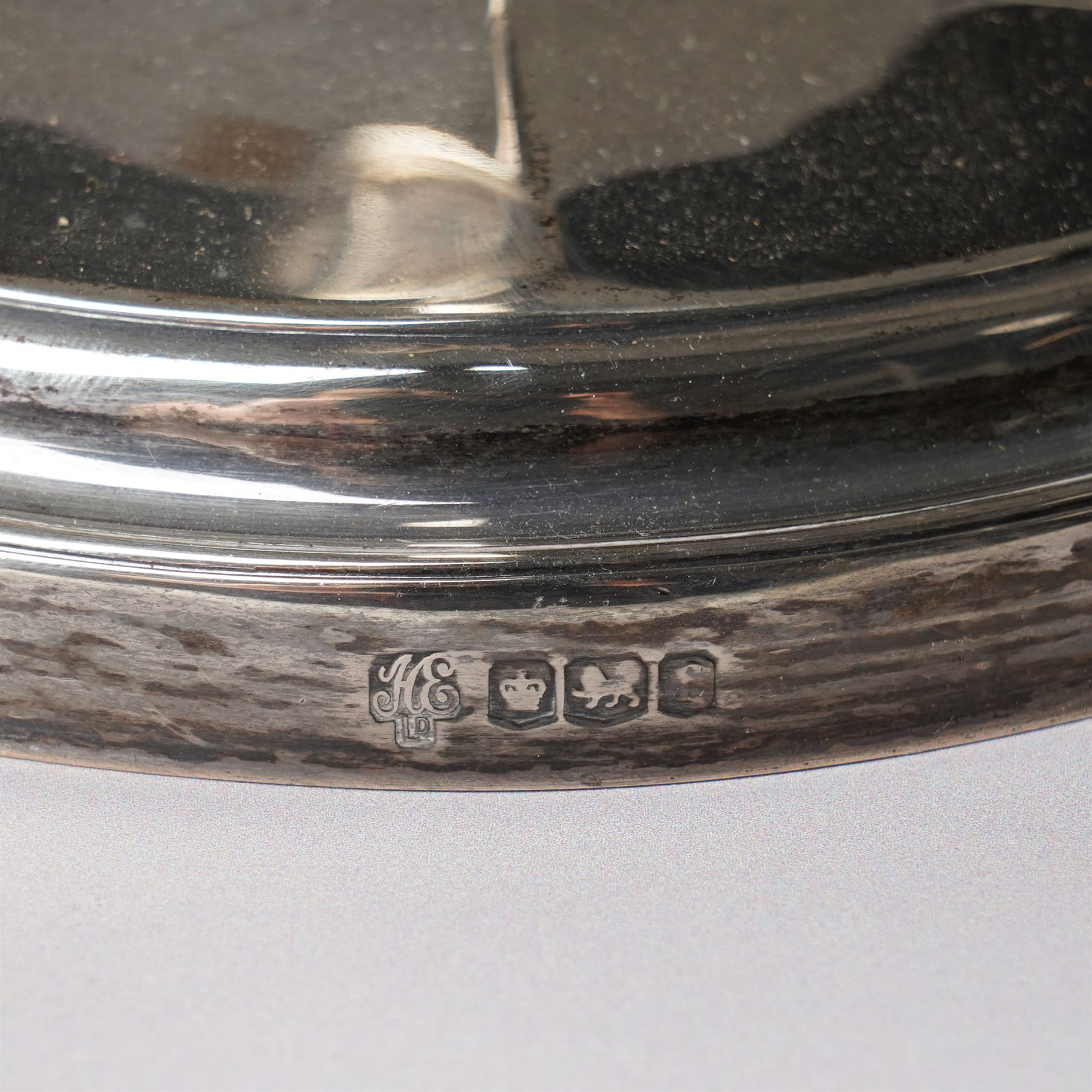 Pair of silver candlesticks with octagonal tapering stems and circular weighted bases H30cm Sheffield 1923 Maker Hawksworth Eyre & Co Ltd