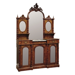  Late Victorian figured walnut break front side cabinet, ornate carved scrolling and shell pediment above bevelled mirror back, drop centre top with marble, two drawers and cupboards, inlaid with boxwood and amboyna, plinth base, W140cm, H212cm, D43cm  